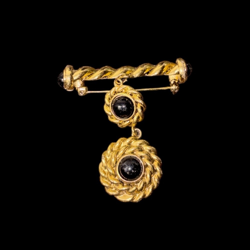vintage gold-tone dangling 2” brooch with black cabochon stones